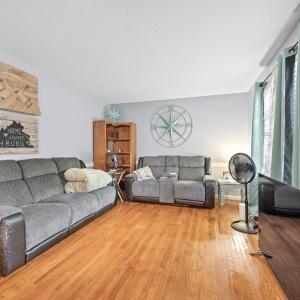 The living room is just off the front door entrance
