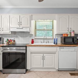 There are cabinets on the wall opposite this too. Convection oven 8 months old. DW 10 years old