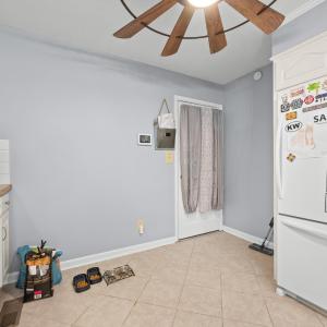 Opposite the kitchen sink. this is the door to the Sunroom