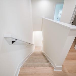 Upstairs offers 3 bedrooms and 2 baths. Similar to photos.