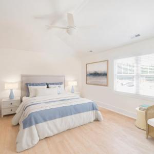 Primary Bedroom with vaulted ceiling and natural light.  Similar to photos.