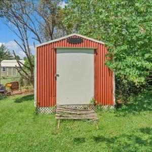 Storage shed conveys as-is!