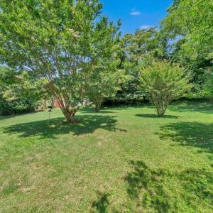 The gorgeous level, and private back yard is perfect for children, pets, and family fun!