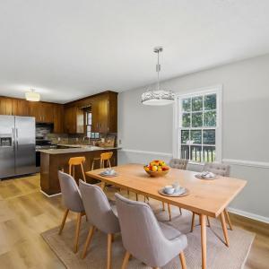 Virtually staged dining area off of kitchen.
