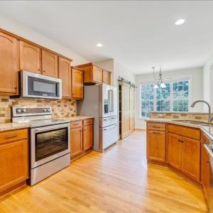 Spacious kitchen offers tons of cabinetry, granite counter tops, and stainless appliances!