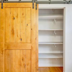 Pantry with barn door perfect for extra storage!