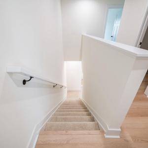 Upstairs offers 3 bedrooms and 2 baths. Similar to photos.