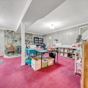 So many options! Perfect space for a den, great room, craft room, game room, or lower level apartment!