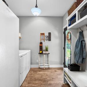 Separate laundry and drop zone right off the back patio and kitchen.
