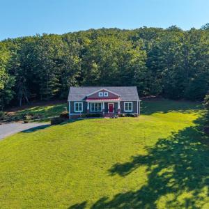 Whether you’re relaxing in a rocking chair on the front porch, enjoying the covered patio, or gathering around the cozy fire pit, you’ll feel a sense of peace and tranquility that is hard to find!