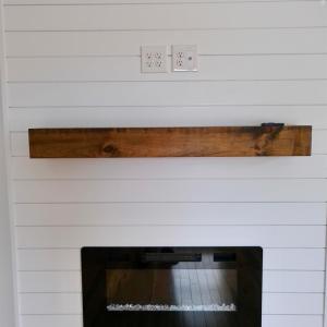 Safe and beautiful fireplace feature! Also notice, electrical and cable ready for no show wires. Keeping the look clean!