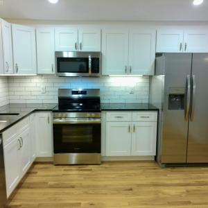 Kitchen is sleek and clean.