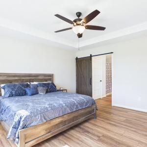 Private Primary Suite featuring Tray Ceiling, Walk-In Closet, and Ensuite Bath.