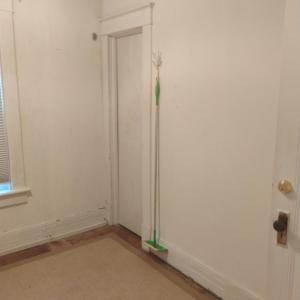 Door to walk-up attic in the kitchenette