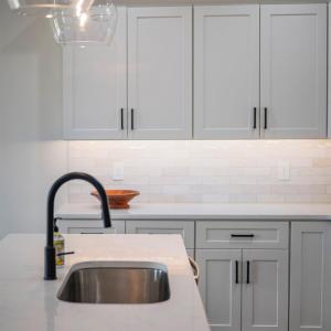 Custom kitchen with quartz counters, tile backsplash, all stainless applicants includes. Finishes may not be exact, but will be similar.