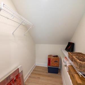 Walk in closet in upstairs bedroom.