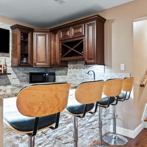 Terrace level bar with sink, dishwasher, refrigerator.