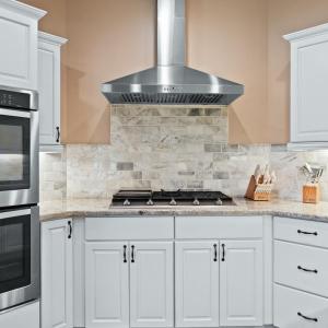 Gas range and double ovens.