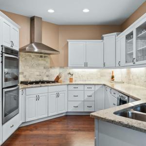 Kitchen with KraftMaid cabinets and under cabinet lighting.