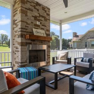 Screened porch with gas fireplace.