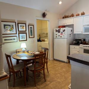 The kitchen area is large enough for a large hutch (on left in pictures), a kitchen table. I the back left corner is the laundry area