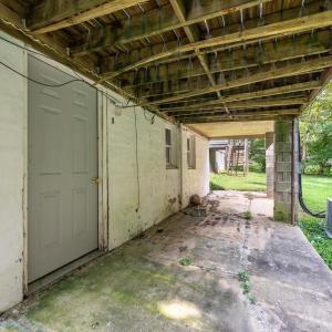 Door to the lower level which has been framed out, has it's own electric meter and also a plumbed out bathroom. Materials convey.