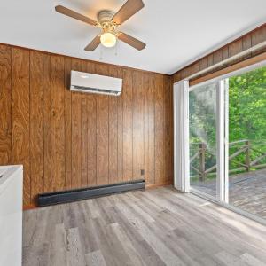 Eating area past the appliances and counters. Slider door to back deck to go out and enjoy nature right in front of Blackwater Creek!