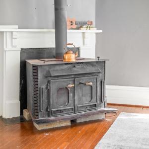 Wood stove in the living room conveys.