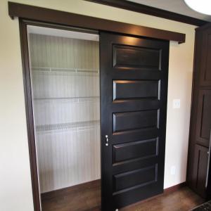 Sliding door pantry in kitchen