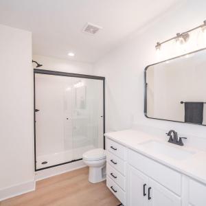 Primary bath offers shower with glass door.  Similar to photos.