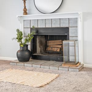 Wood burning fireplace in den