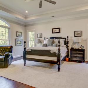 Primary Bedroom - Large and spacious - with vaulted ceilings, ceiling fan and recessed lighting.  Exterior door to back patio