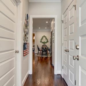 Garage Door entry - going past the Laundry Room, Pantry, and looking into the Kitchen breakfast seating area.