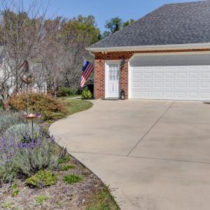 Concrete Drive with double car smart garage entry and additional exterior door for home entry