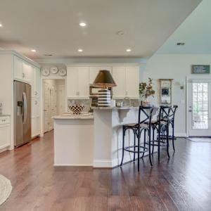 View from Hallway, into the Great Room, Kitchen/Bar and Seating area within the Kitchen.
