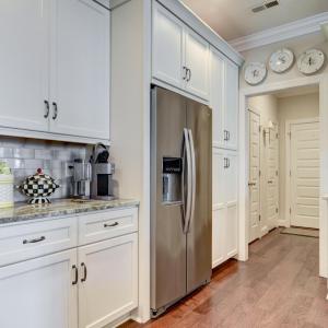 Kitchen View towards the Garage entry and Laundry Room & Pantry areas