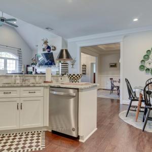 Kitchen - Sink and Dishwasher area and a view towards the great room, kitchen seating area, and formal dining room/front entry