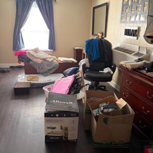 large bedroom. owner is storying some boxes for a relative