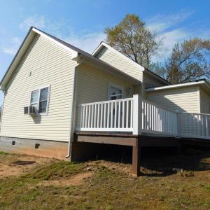 Left of House with view of large deck for your enj