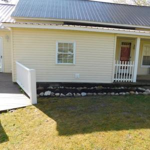 Front  showing new ramp and exterior entrance to a