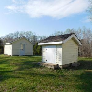 Well house with storage building in back.
