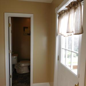 Back entry foyer looking into 1/2 bath