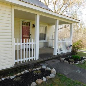 Front porch and flower beds. Landscaping just star