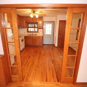 French pocket doors lead to kitchen