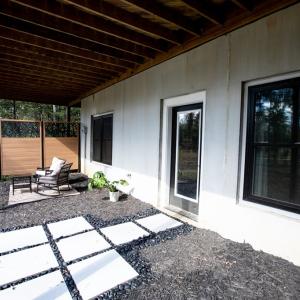 sitting outside walk out basement overlooking pond