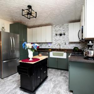 Kitchen, New appliances, new kitchen cabinets, farmhouse sink, & butcher block countertops.