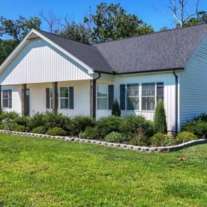 Landscaping and Established Lawn, Professionally Designed Landscaping with Established Lawn, Concrete Borders, and Thoughtfully Planned Plantings.