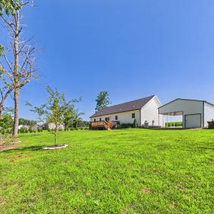Level Backyard with Established Lawn, Fruit Trees, and Plenty of Space for Outdoor Enjoyment.