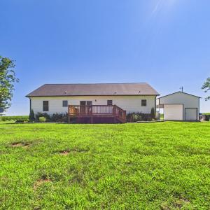 Level Backyard with Established Lawn, Fruit Trees, and Plenty of Space for Outdoor Enjoyment.