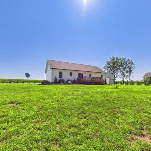 Level Backyard with Established Lawn, Fruit Trees, and Plenty of Space for Outdoor Enjoyment.